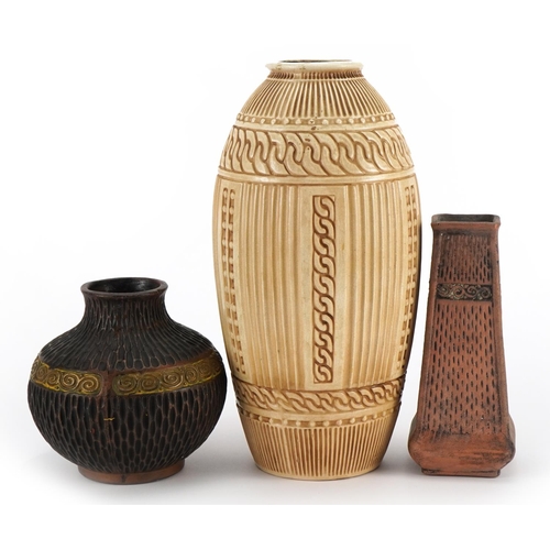 442 - Three Bretby pottery vases including two Clanta examples, 29cm high