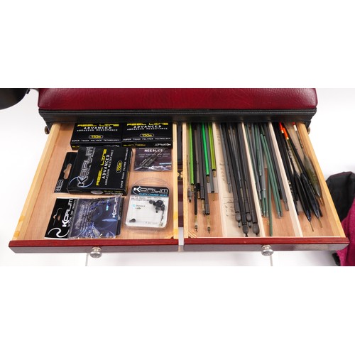 669 - Boss fishing tackle box with a selection of fishing tackle including floats, hooks and lines