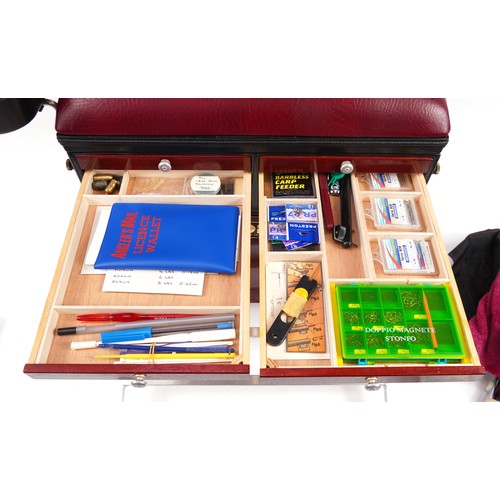 669 - Boss fishing tackle box with a selection of fishing tackle including floats, hooks and lines