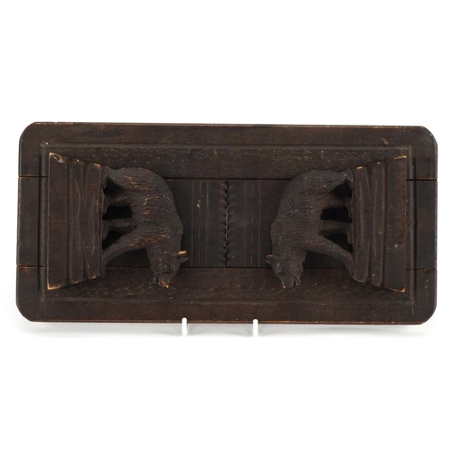 624 - Black Forest extending book slide carved with two bears, 30.5cm wide when closed