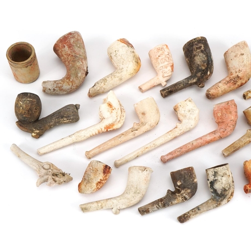 416 - Collection of antique and later clay pipes including one in the form of a foot kicking a football