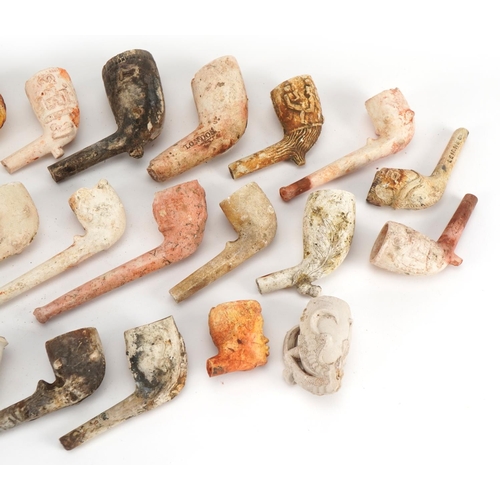 416 - Collection of antique and later clay pipes including one in the form of a foot kicking a football