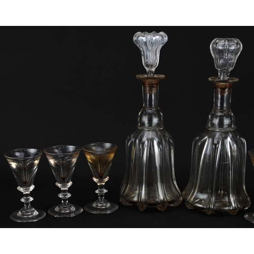 250 - Set of six 18th century illusion glasses and a pair of decanters, the largest 31cm high