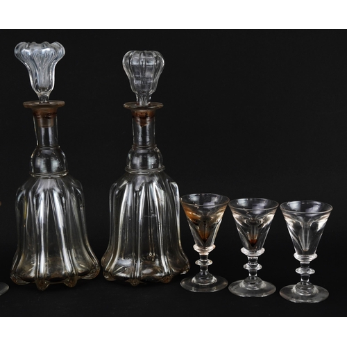 250 - Set of six 18th century illusion glasses and a pair of decanters, the largest 31cm high