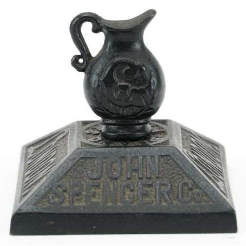 542 - Early 20th century cast iron paperweight advertising John Spencer Co of London Piano Makers, 6.5cm h... 