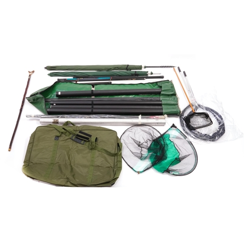 668 - Large selection of fishing tackle and accessories including nets, clothing, floats, hooks, tackle bo... 