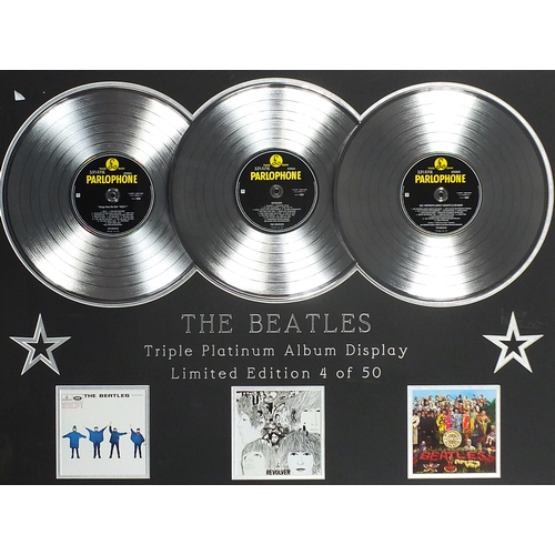 2458 - The Beatles triple platinum album display comprising Help!, Revolver and Sgt Pepper's Lonely Hearts ... 