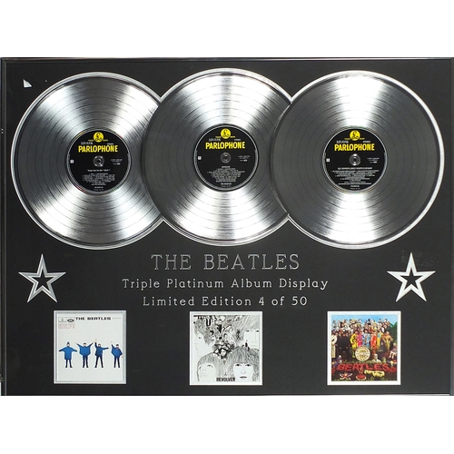 2458 - The Beatles triple platinum album display comprising Help!, Revolver and Sgt Pepper's Lonely Hearts ... 