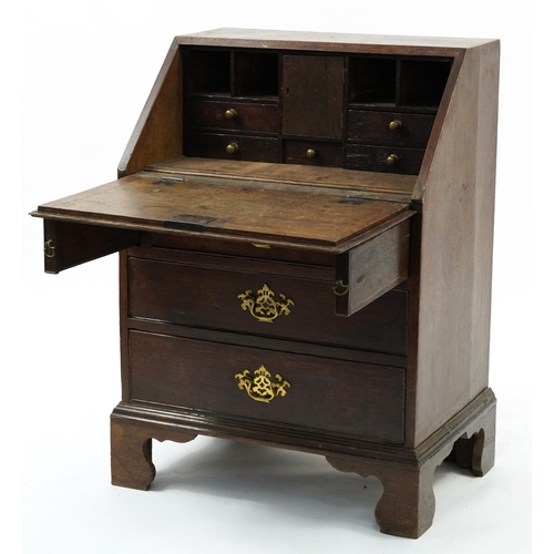 876 - George III oak child's bureau with fitted interior and brass handles, 87cm H x 62cm W x 44cm D