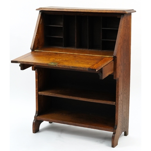 875 - Art Nouveau oak student's bureau with copper mounts, 100cm H x 76cm W x 30.5cm D