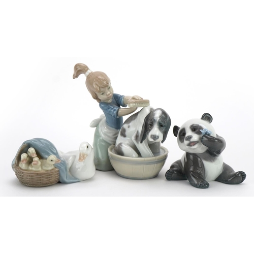 979 - Lladro figures and animals including a panda and one of a girl washing a dog numbered 5455, the larg... 