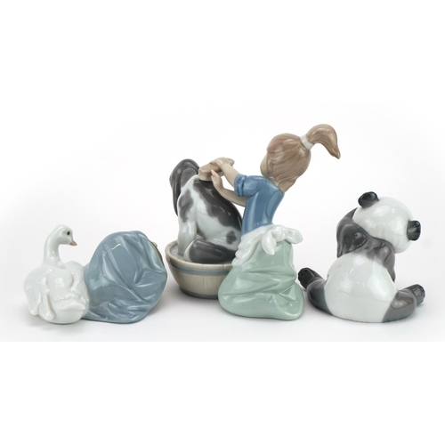 979 - Lladro figures and animals including a panda and one of a girl washing a dog numbered 5455, the larg... 