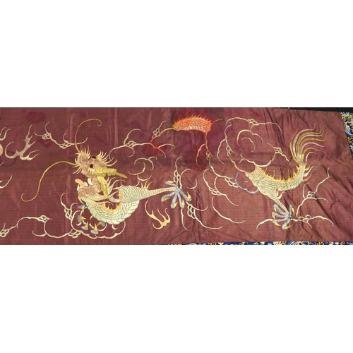 142 - Chinese silk banner finely embroidered with dragons chasing a flaming pearl amongst clouds within a ... 