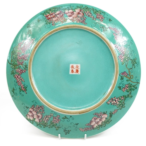 394 - Chinese porcelain turquoise ground charger hand painted with a quail amongst flowers, four figure ch... 