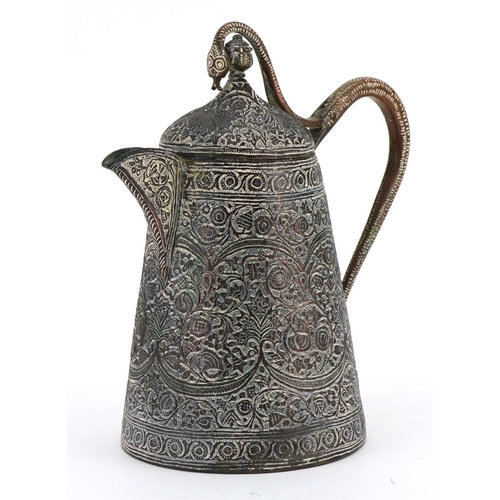 277 - Indian copper jug with serpent handle profusely engraved and decorated in low relief with flowers, 2... 