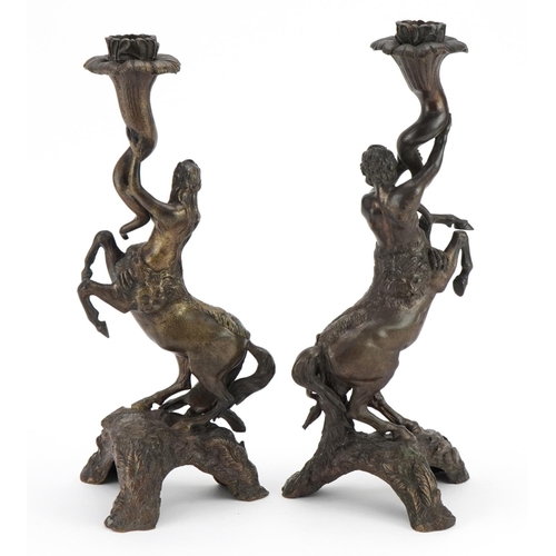 17 - Pair of 19th century style patinated bronze candlesticks in the form of male and female centaurs, th... 