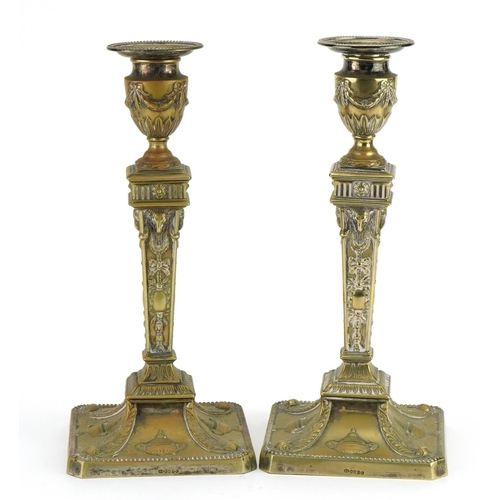 625 - Pair of early 20th century silver plated  Adams Revival candlesticks with rams heads and urns, each ... 