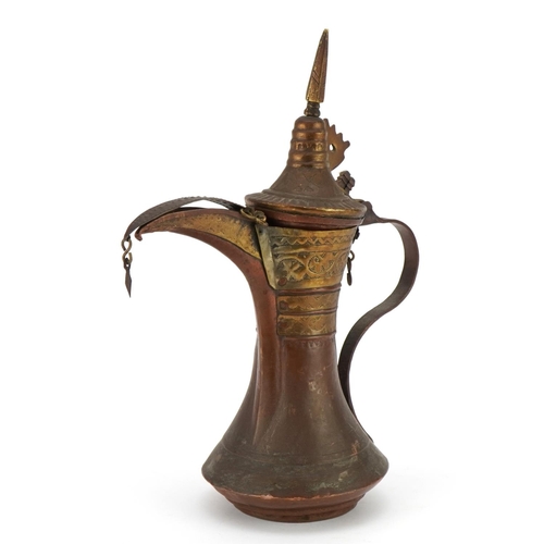 89 - Omani copper and brass dallah coffee pot, 28.5cm high