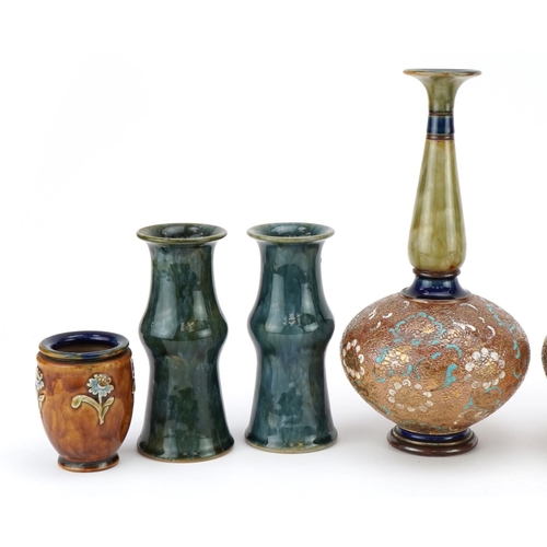 485 - Royal Doulton stoneware comprising three pairs of vases and a three footed cauldron, the largest eac... 