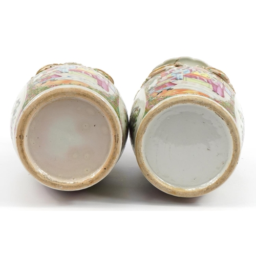 506 - Pair of Chinese porcelain Canton vases with animalia relief decoration and twin handles, hand painte... 