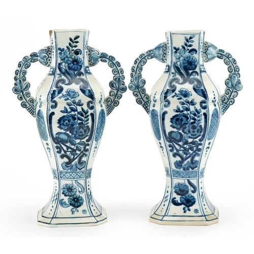 358 - Villeroy & Boch, pair of Dutch Delft tin glazed vases with twin handles hand painted with flowers, e... 