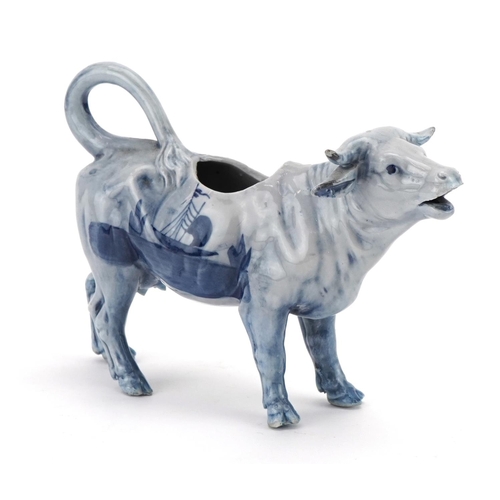 359 - Dutch Delft cow creamer hand painted with windmill and boat, 17.5cm in length