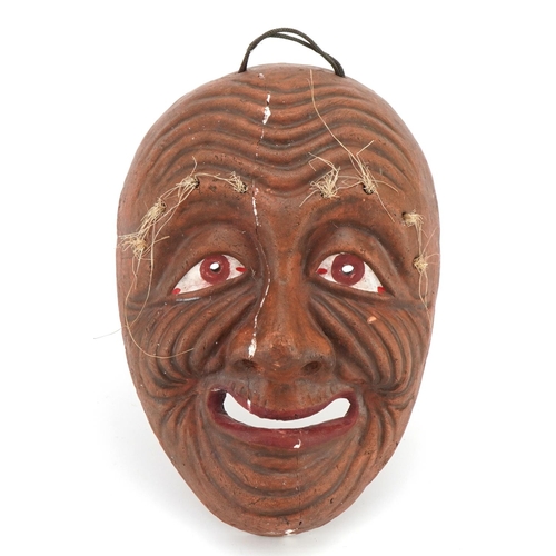 213 - Japanese pottery Noh theatre mask, impressed character marks to the reverse, 20.5cm high