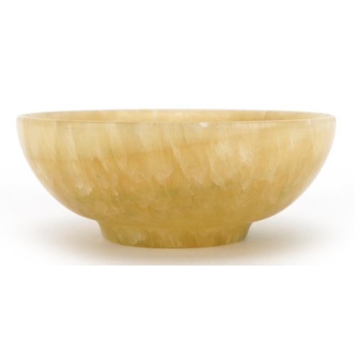 995 - Chinese green and russet hardstone bowl, possibly flourite or Jade, 11cm in diameter