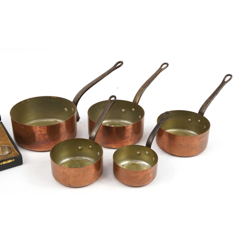 623 - Graduated set of five 19th century copper and iron saucepans and a set of six silver plated preserve... 