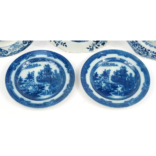 513 - Three Chinese blue and white porcelain plates hand painted with flowers and a river landscape togeth... 