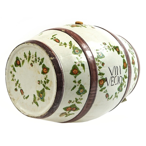 357 - Italian faience glazed pottery barrel with brass tap, inscribed Vin Vecio, hand painted with flowers... 