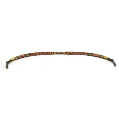 156 - Turkish Ottoman fighting bow hand painted and gilded with flowers, 88cm high