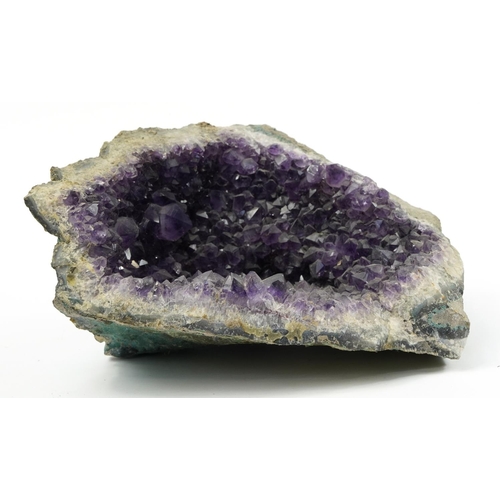 674 - Section of an amethyst geode, 30.5cm wide