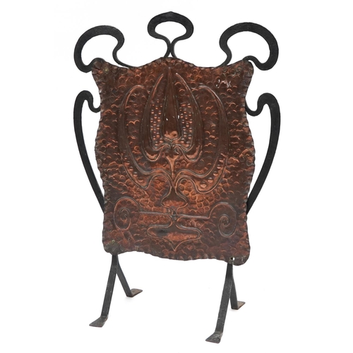 132 - Arts & Crafts beaten copper and wrought iron fire screen embossed with stylised motifs, 78.5cm high ... 