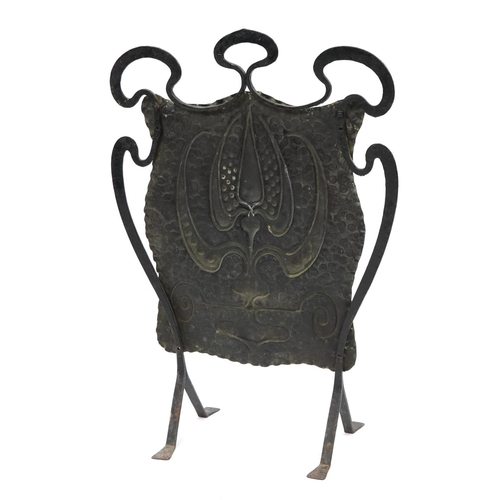 132 - Arts & Crafts beaten copper and wrought iron fire screen embossed with stylised motifs, 78.5cm high ... 