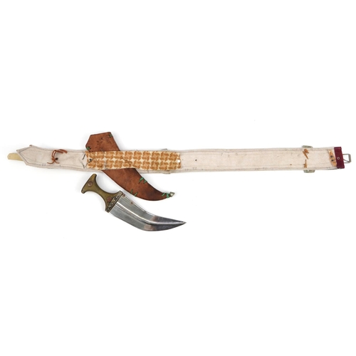 90 - Omani Jambiya dagger with horn handle and white metal mounts on embroidered belt, the dagger 39.5cm ... 