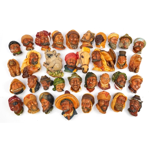 960 - Large collection of Bossons hand painted plaster wall plaques, the largest 20cm in length