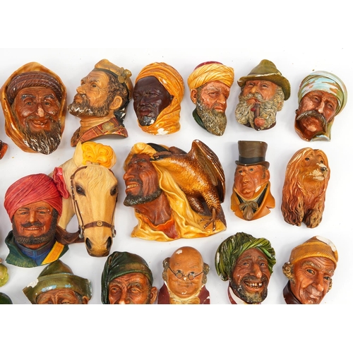 960 - Large collection of Bossons hand painted plaster wall plaques, the largest 20cm in length