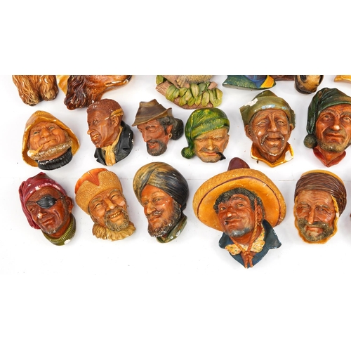 960 - Large collection of Bossons hand painted plaster wall plaques, the largest 20cm in length