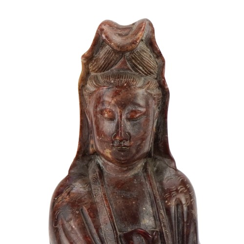 77 - Good pair of Chinese soapstone carvings of Guanyin seated on a mythical animal, each 21cm high