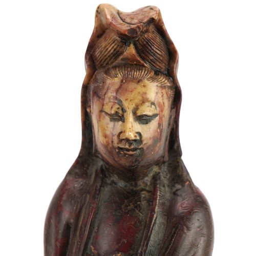 77 - Good pair of Chinese soapstone carvings of Guanyin seated on a mythical animal, each 21cm high