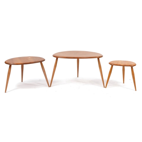 853 - Nest of three Ercol light elm pebble occasional tables, the largest 39cm H x 64.5cm W x 43cm D