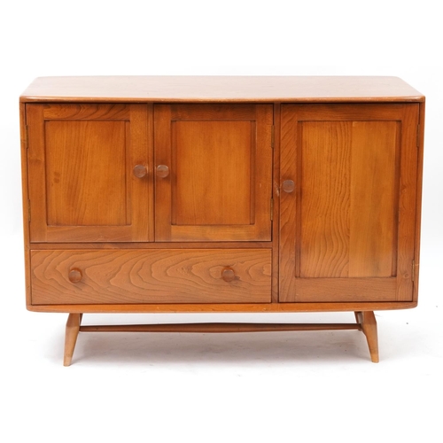 862 - Vintage Ercol light elm sideboard fitted with three cupboard doors and two drawers, 82cm H x 114cm W... 