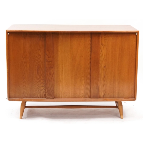 862 - Vintage Ercol light elm sideboard fitted with three cupboard doors and two drawers, 82cm H x 114cm W... 