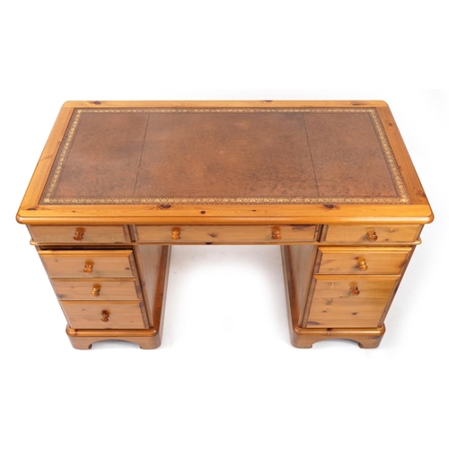 866 - Pine twin pedestal desk with tooled leather insert, 76cm H x 121cm W x 63cm D