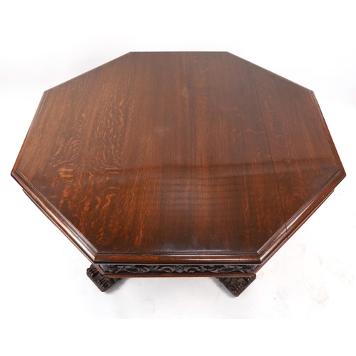 868 - Oak centre table with octagonal top having four frieze drawers on bulbous supports with carved lion ... 