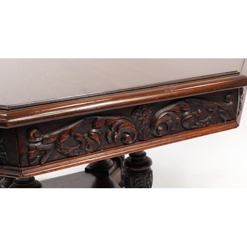 868 - Oak centre table with octagonal top having four frieze drawers on bulbous supports with carved lion ... 