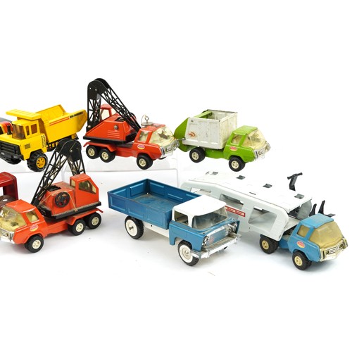 1554 - Vintage tinplate vehicles including Tri-ang and Tonka, the largest 43cm in length