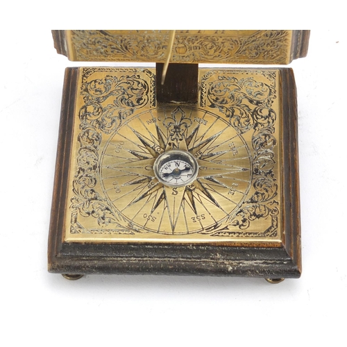 628 - Antique oak backed brass sundial and compass, 15.5cm high