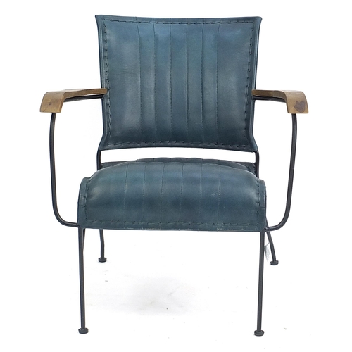 916 - Industrial style wrought iron and green leather open armchair, 74cm high